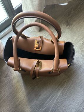 Brown  medium luggage color..Leather Top-Handle Couture Bag